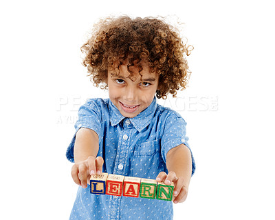 Buy stock photo Learning, studio and portrait of kid with building blocks for playing, education or child development. Creative, happy and isolated young boy with school toys for spelling games on white background