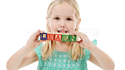 Buy stock photo Building blocks, learn and portrait of kid in studio for skills, education and child development. Creative, childhood and isolated young girl with school toys for spelling games on white background