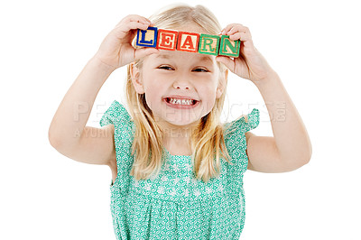 Buy stock photo Smile, studio and face of kid with building blocks for learning, education and child development. Creative, childhood and isolated young girl with school toys for spelling games on white background