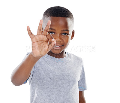 Buy stock photo Boy, portrait and ok sign at studio with mockup space for good job, agreement and support with smile. Black child, happy and hand gesture for thank you, motivation and achievement on white background