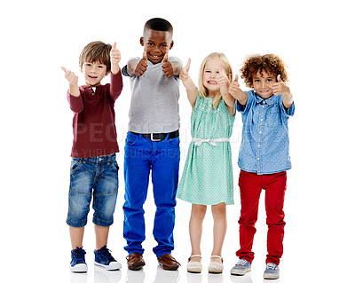 Buy stock photo Children, group and together for thumbs up in studio portrait with smile, agreement and white background. Girl, boy or isolated friends for happiness, hand like or solidarity for kids with diversity