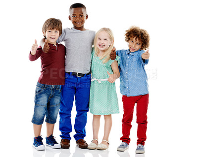 Buy stock photo Kids, group and thumbs up for diversity in studio portrait with smile, hug or care by white background. Girl, boy or isolated friends for happiness, hand sign or solidarity for children with kindness