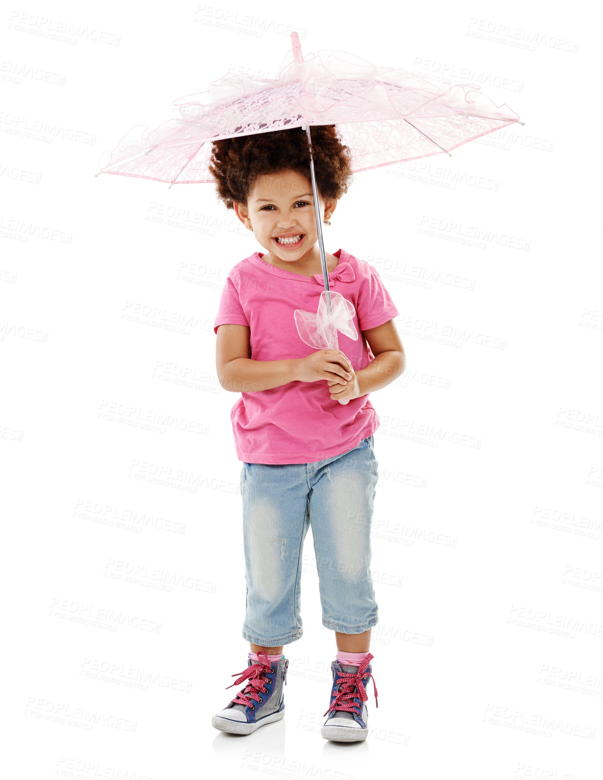 Buy stock photo Happy, umbrella and portrait of child in studio for winter season, rainfall and protection from weather. Fashion, smile and isolated young girl with plastic cover for safety on white background