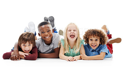 Buy stock photo Diversity, portrait of happy children and smiling together in a white background. Happiness or excited,  group of friends and multiracial kids and faces have fun, laugh and lay on a isolated studio