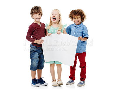 Buy stock photo Studio shot of a group of young friends holding up a blank placard together against a white background