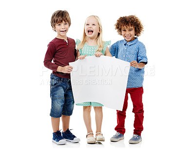 Buy stock photo Happy children, poster and sign with mockup space for advertising, message or school project in studio. Young kids, group or kindergarten students with paper for presentation, notification or alert