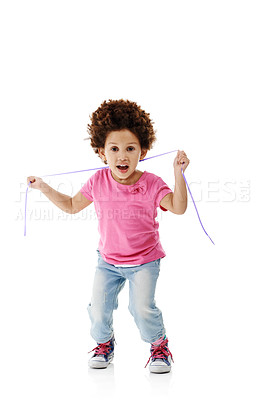 Buy stock photo Young girl, portrait and playing with fun, ribbon and game with youth fashion and style in studio. String, jeans and African child from Morrocco with smile, happy and afro on white background