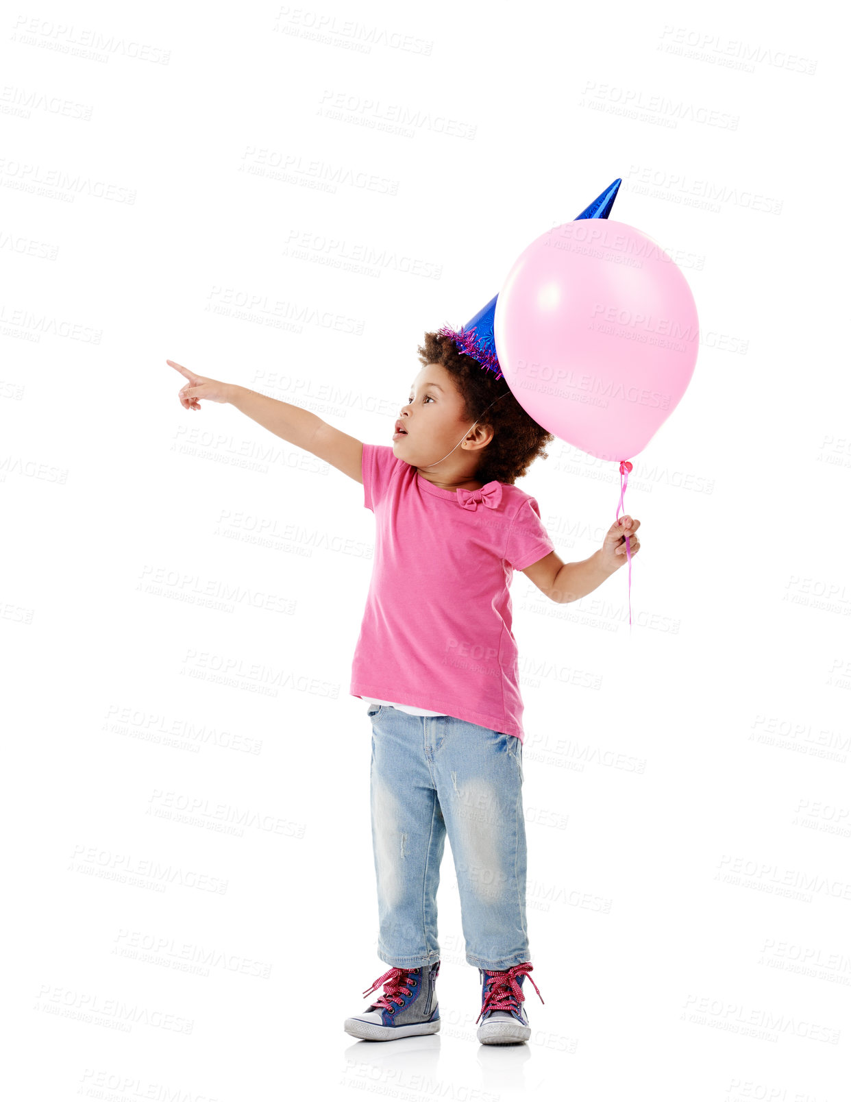 Buy stock photo Balloon, party hat and child in studio pointing for birthday, celebration or fun with event. Smile, decoration and kid with flying inflatable helium accessory for gift isolated by white background.