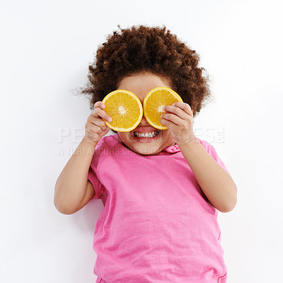 Buy stock photo Happy kid, lemon or vitamin C with fruit for nutrition, detox or sour face on a white studio background. Young, child or female person with smile or tongue out for citrus taste, diet or natural snack