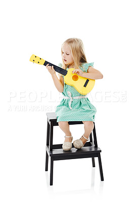 Buy stock photo Happy, guitar and child in studio for learning music, practice and playing songs on step. Talent, creative and isolated young girl with musical instrument for pretend performance on white background