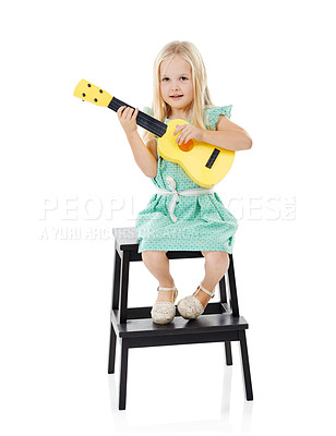 Buy stock photo Music, guitar and portrait of child in studio on step for playing on toy, practice and learning songs. Talent, creative and isolated young girl perform with musical instrument on white background