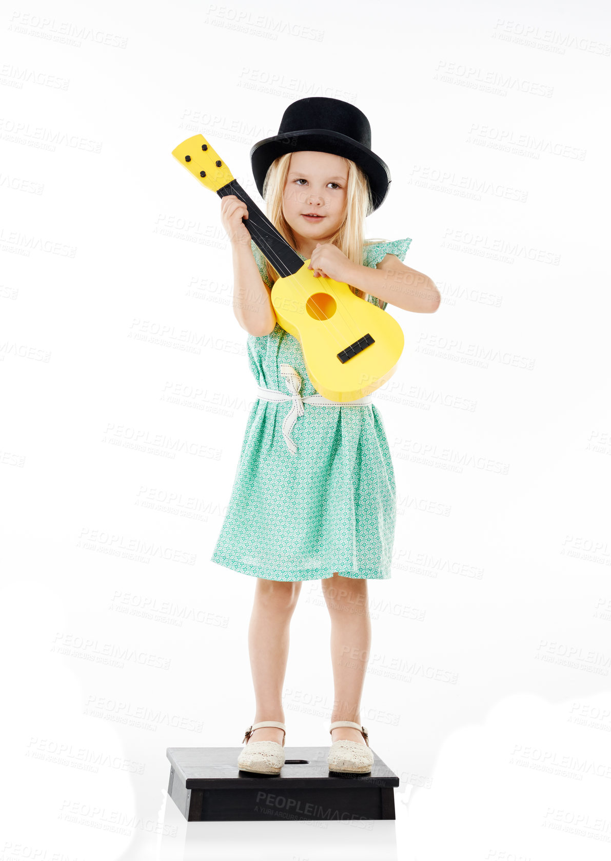 Buy stock photo Happy, guitar and child in studio on step for playing music, practice and learning songs. Performance, creative and isolated young girl with musical instrument for talent show on white background