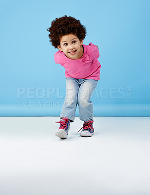 Buy stock photo Shot of an adorable little girl smiling at the camera