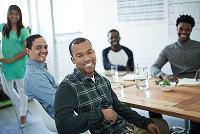 Buy stock photo Portrait of young businesspeople sitting in a boardroom 