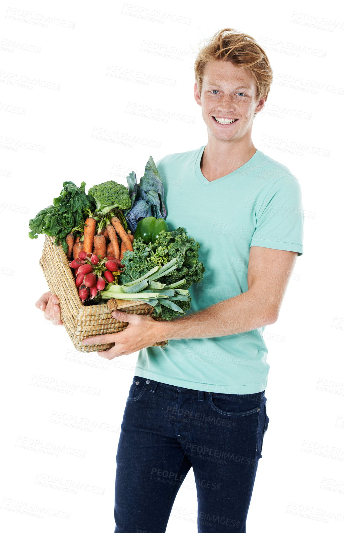 Buy stock photo A smiling young red-headed man holding a basket filled with fresh organic vegetables
