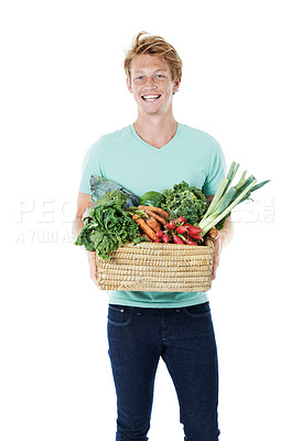 Buy stock photo Man, vegetables and basket in studio, smile and portrait with organic produce by white background. Person, shopping and container with groceries, nutrition and vegan diet with discount in Spain