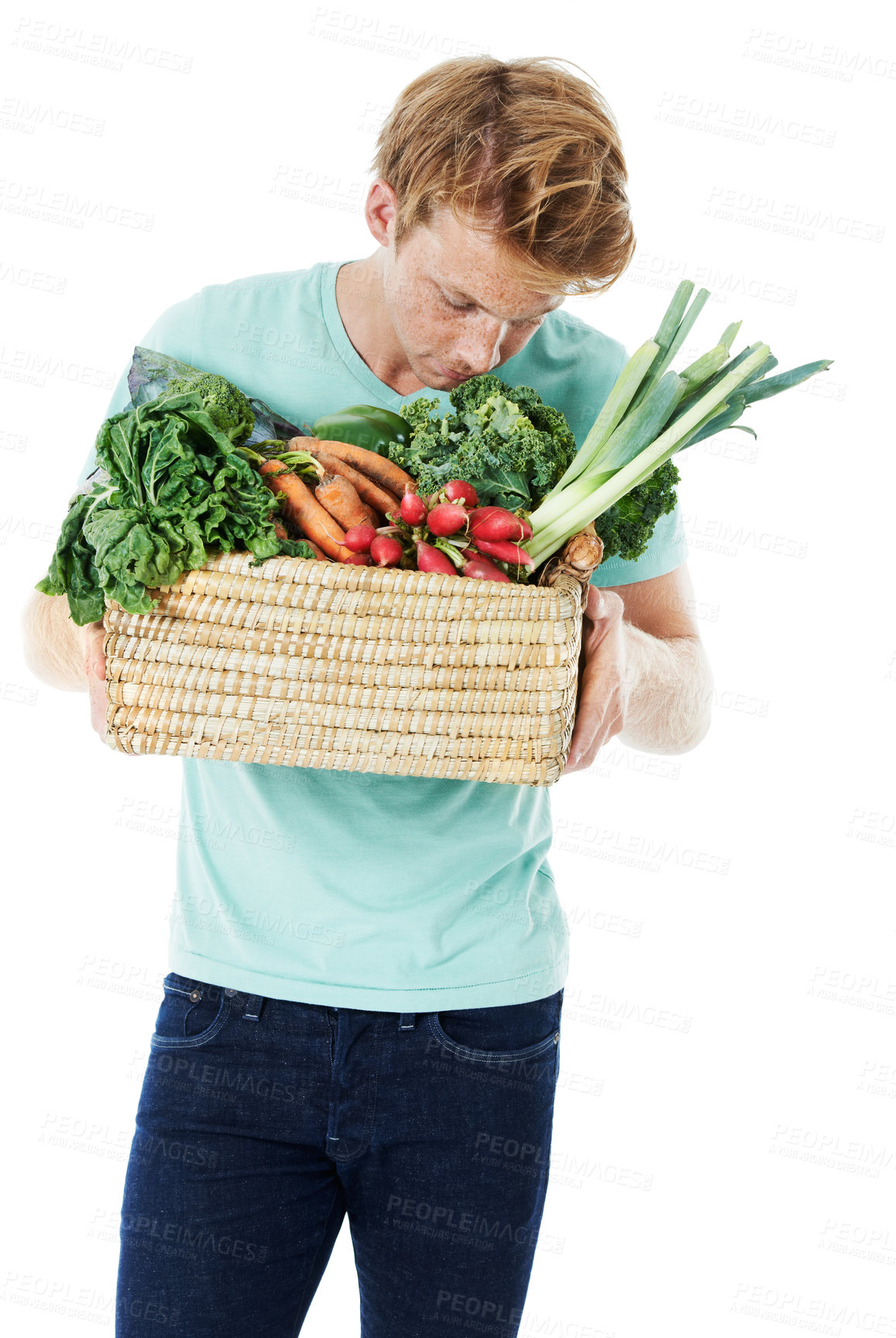 Buy stock photo Man, smell vegetables and basket in studio, shopping and organic produce by white background. Person, thinking and container with groceries, nutrition or scent for vegan food with discount for diet