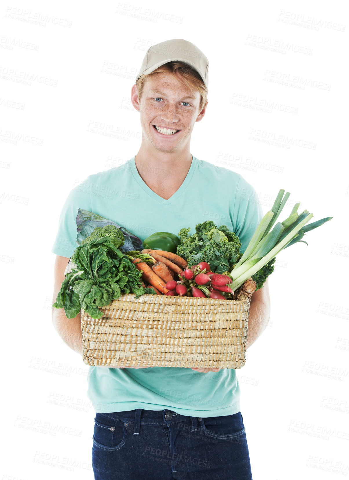 Buy stock photo Delivery man, vegetables and basket in studio portrait with smile, sale and organic produce by white background. Person, container and happy with groceries, package and excited with food in Spain