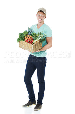 Buy stock photo Man, portrait and happy with vegetables in basket in studio for eco friendly small business and fresh produce. Mockup space, face and person with smile for healthy food supplier on white background