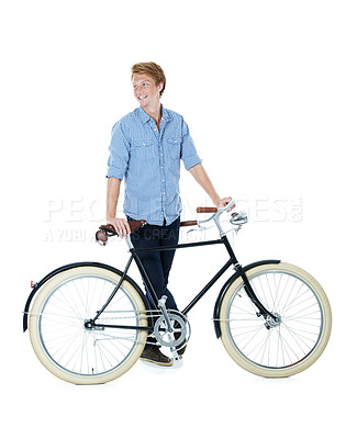 Buy stock photo A handsome young red-headed man standing next to an old-fashioned bicycle