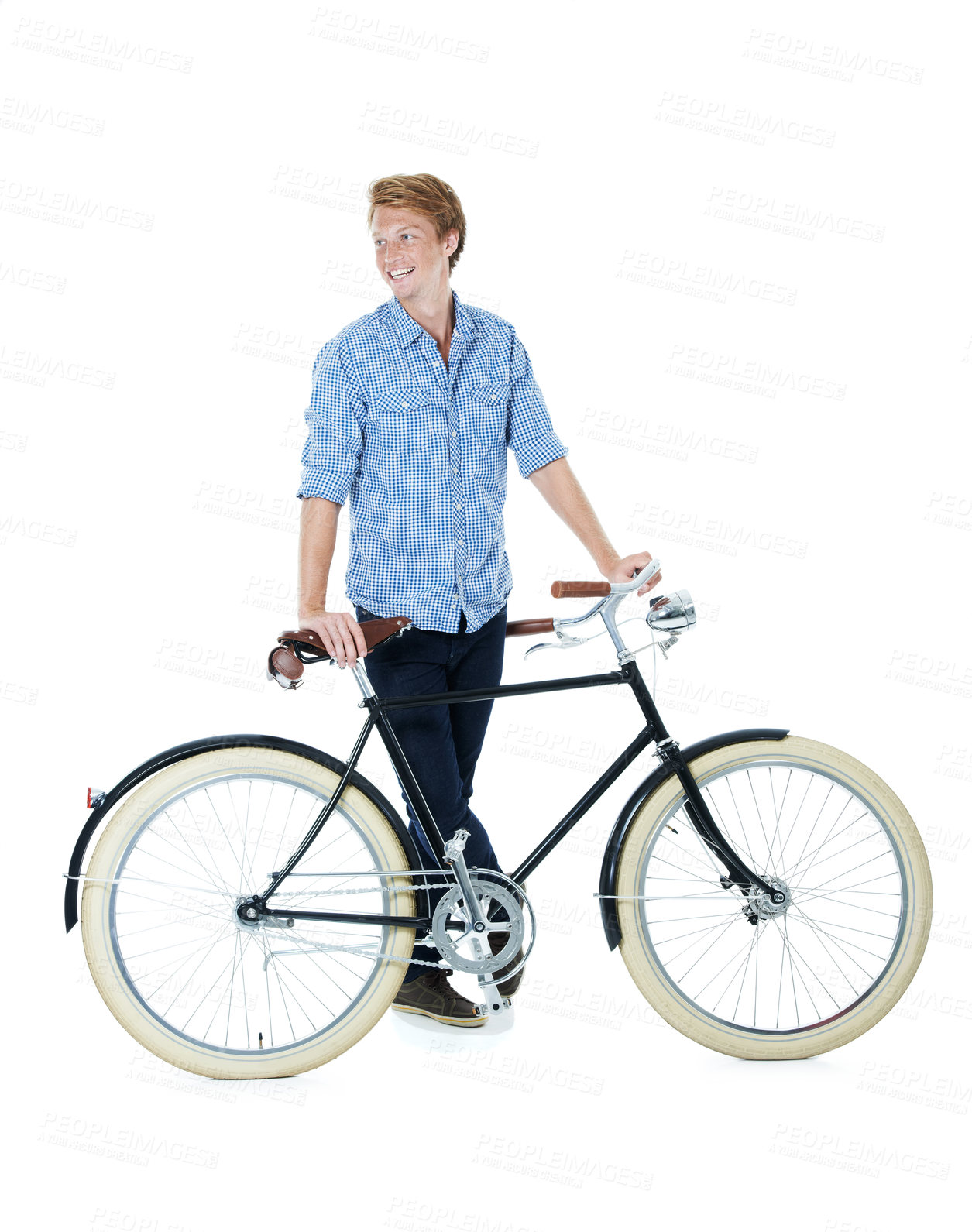 Buy stock photo A handsome young red-headed man standing next to an old-fashioned bicycle