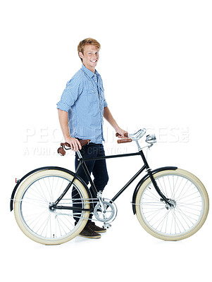 Buy stock photo Bike, portrait and young man with smile and eco friendly transport to university in studio. Sustainability, happy and travel with cycling and carbon neutral college student with white background