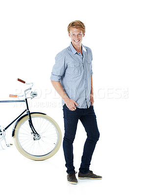 Buy stock photo Bicycle, portrait and young man with confidence and eco friendly transport to university in studio. Sustainability, happy and travel with body and carbon neutral college student with white background