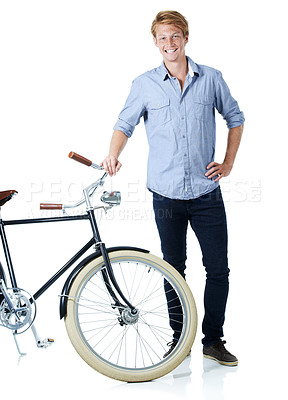 Buy stock photo Bicycle, happy portrait and young man with smile and eco friendly transport to university in studio. Sustainability, joy and travel with cycling and carbon neutral student with white background