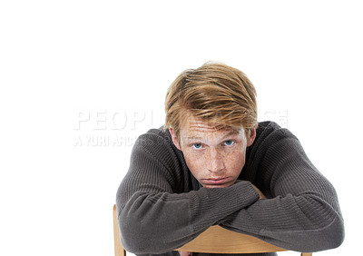 Buy stock photo Portrait, freckles and man on chair, fashion and confident person isolated on white studio background. Face, model and guy sitting, aesthetic and mockup space with pride, relaxing and comfortable