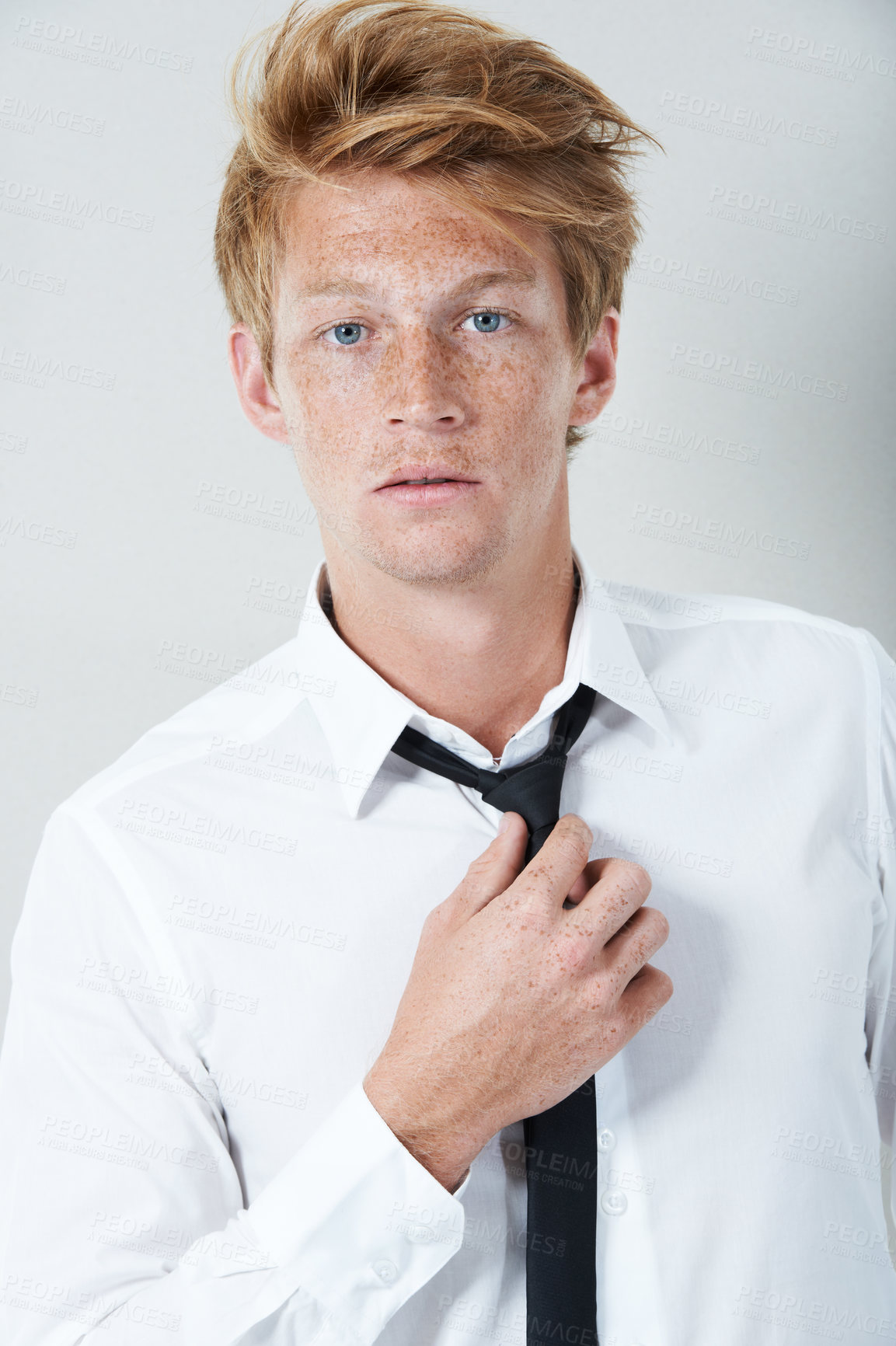 Buy stock photo Studio portrait of a young man staring at the camera