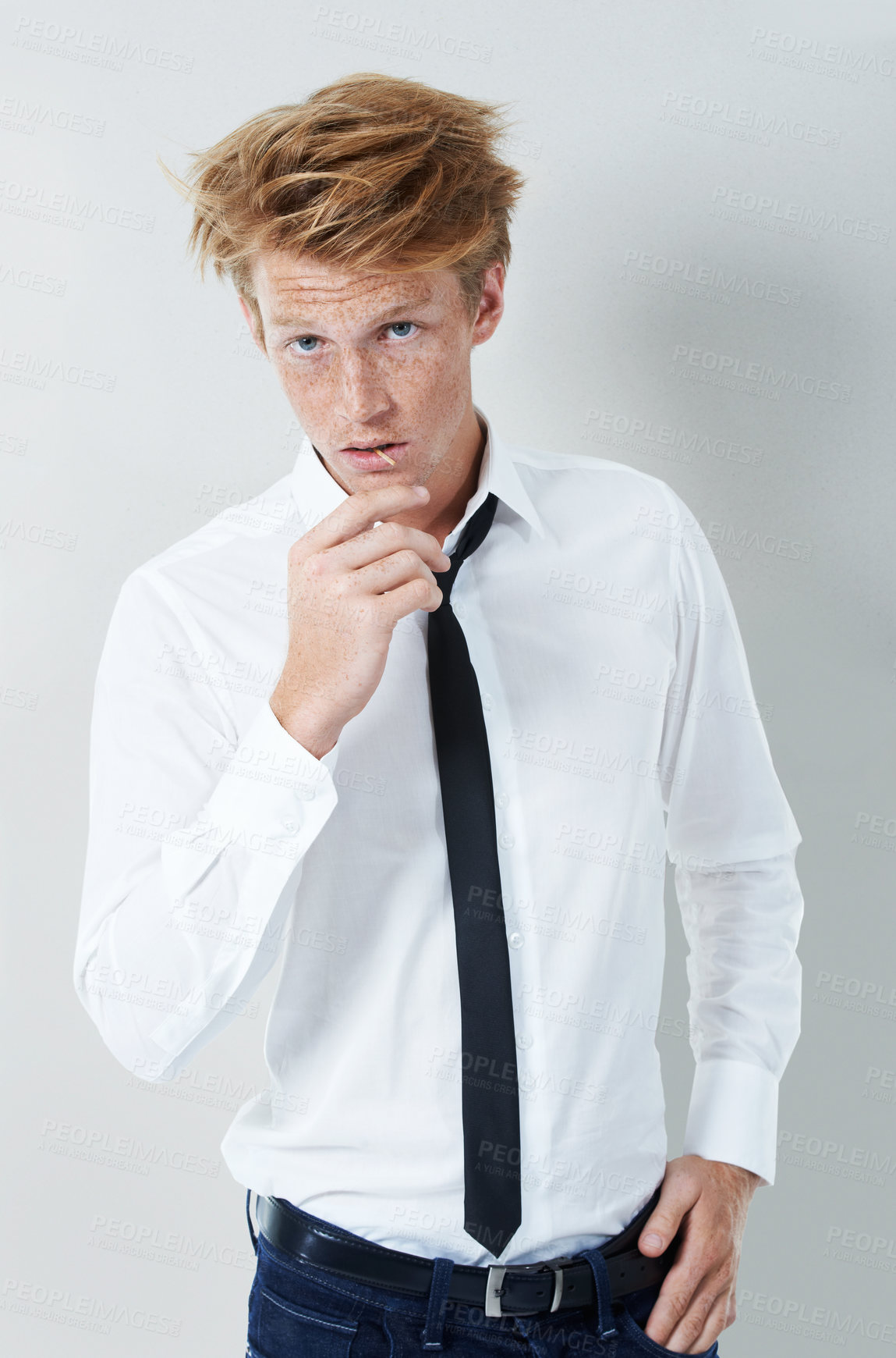 Buy stock photo Cool, attitude or portrait of man with tie, pride or elegant shirt for modern attire with matchstick. Fashion, edgy clothes or confident model in studio with classic style on white background in USA