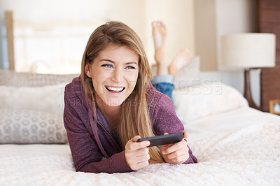 Buy stock photo Teenager, happy and girl with games, using phone and relax in bedroom, smile with technology and esports. Young female person at home, gaming and mobile app with happiness, gen z and internet