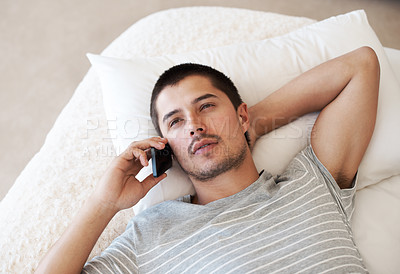 Buy stock photo Man, phone call and talking on bed in home for conversation, mobile chat and communication on top view. Serious person, smartphone and relax in bedroom with thinking, discussion or social network