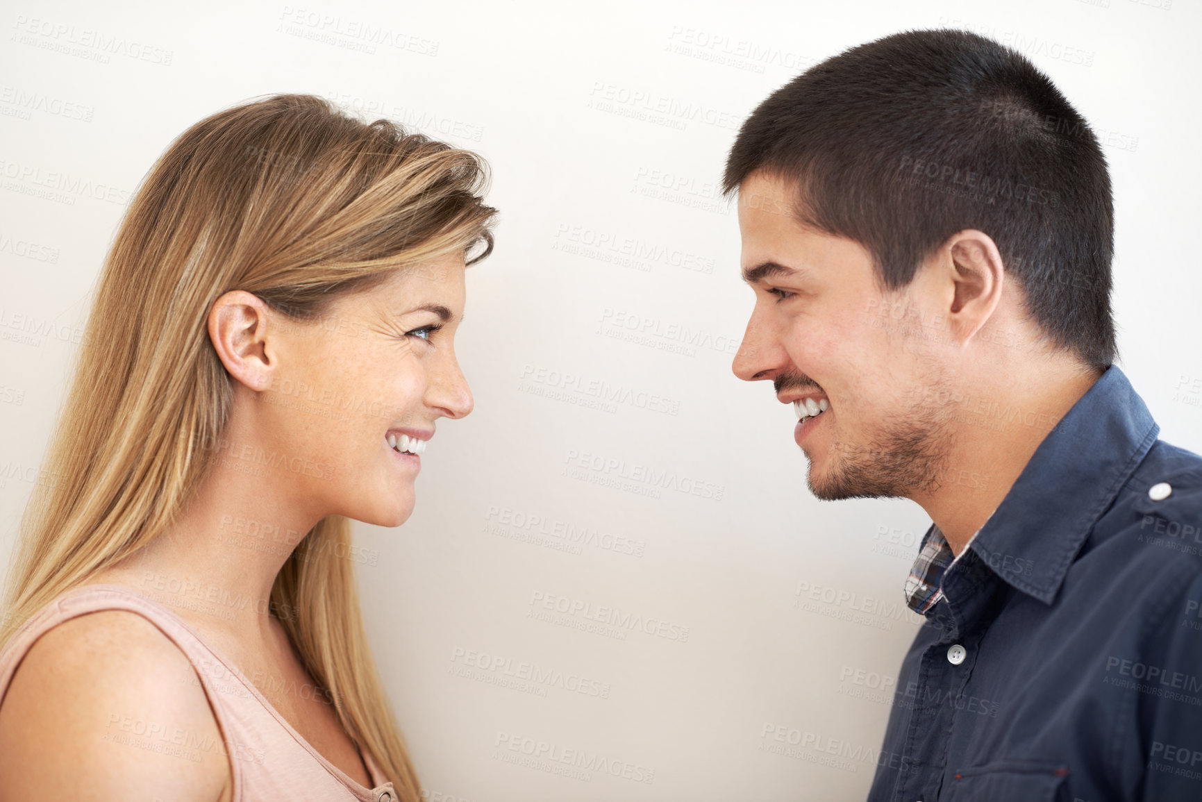 Buy stock photo Couple, profile and happy with love in studio for marriage, bonding and romantic connection. Man, woman and relax with smile in commitment by white background for care, trust and loyalty together