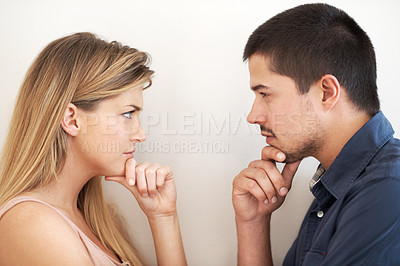 Buy stock photo Argument, upset and profile of couple in studio with disagreement, conflict and relationship drama. Angry, fight and young man and woman thinking of resolution for toxic marriage by white background.