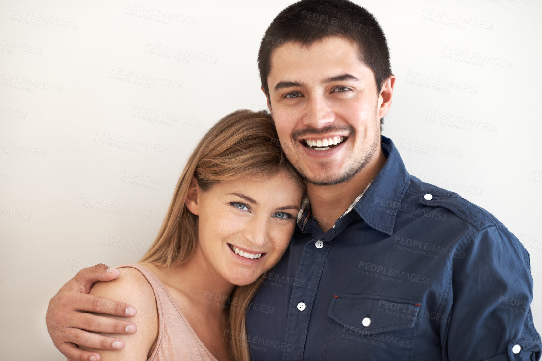 Buy stock photo Care, hugging and portrait of couple in studio with love, marriage and romantic connection. Happy, people and young man and woman embracing and bonding in relationship together by white background.