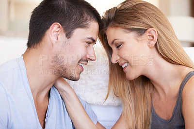 Buy stock photo Face, intimacy and couple relax and bond in a living room happy, sweet and sharing romance in their home together. Smile, embrace and woman with man in a lounge for conversation, love and hangout