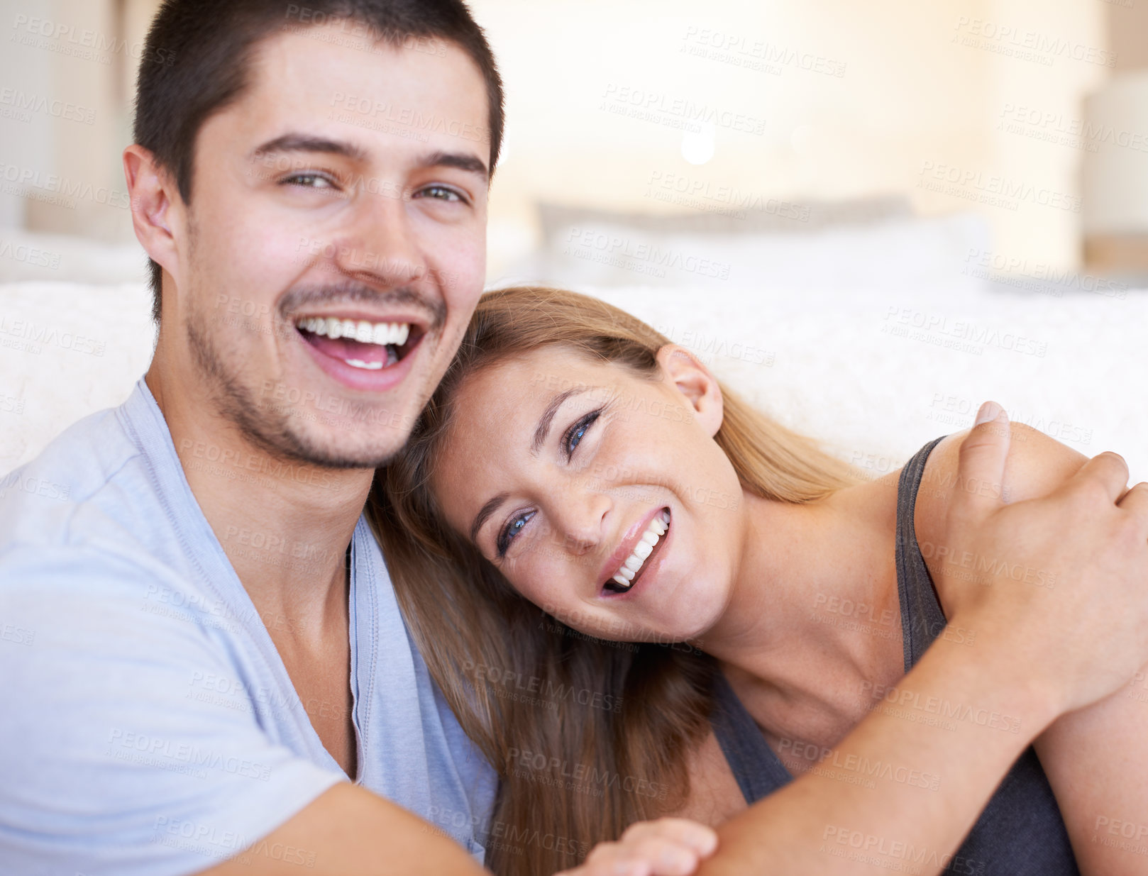 Buy stock photo Happy, hugging and portrait of couple in house with love, marriage and romantic connection in living room. Smile, cute and people embracing, relaxing and bonding in relationship together in home.