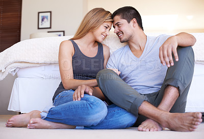 Buy stock photo Content young couple relaxing together happily