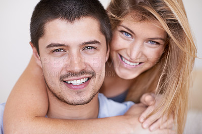 Buy stock photo Attractive young couple relaxing together happily at home