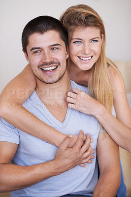 Buy stock photo Smile, hugging and couple in house with love, marriage and romantic connection in living room. Happy, people and young man and woman embracing, relaxing and bonding in relationship together in home.