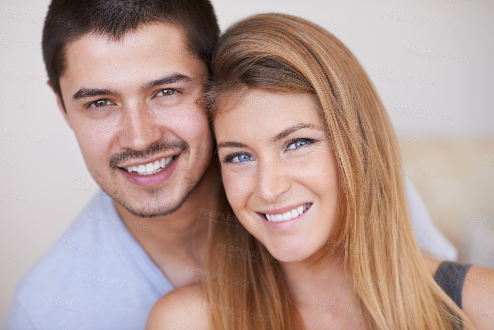 Buy stock photo Attractive young couple relaxing together happily at home