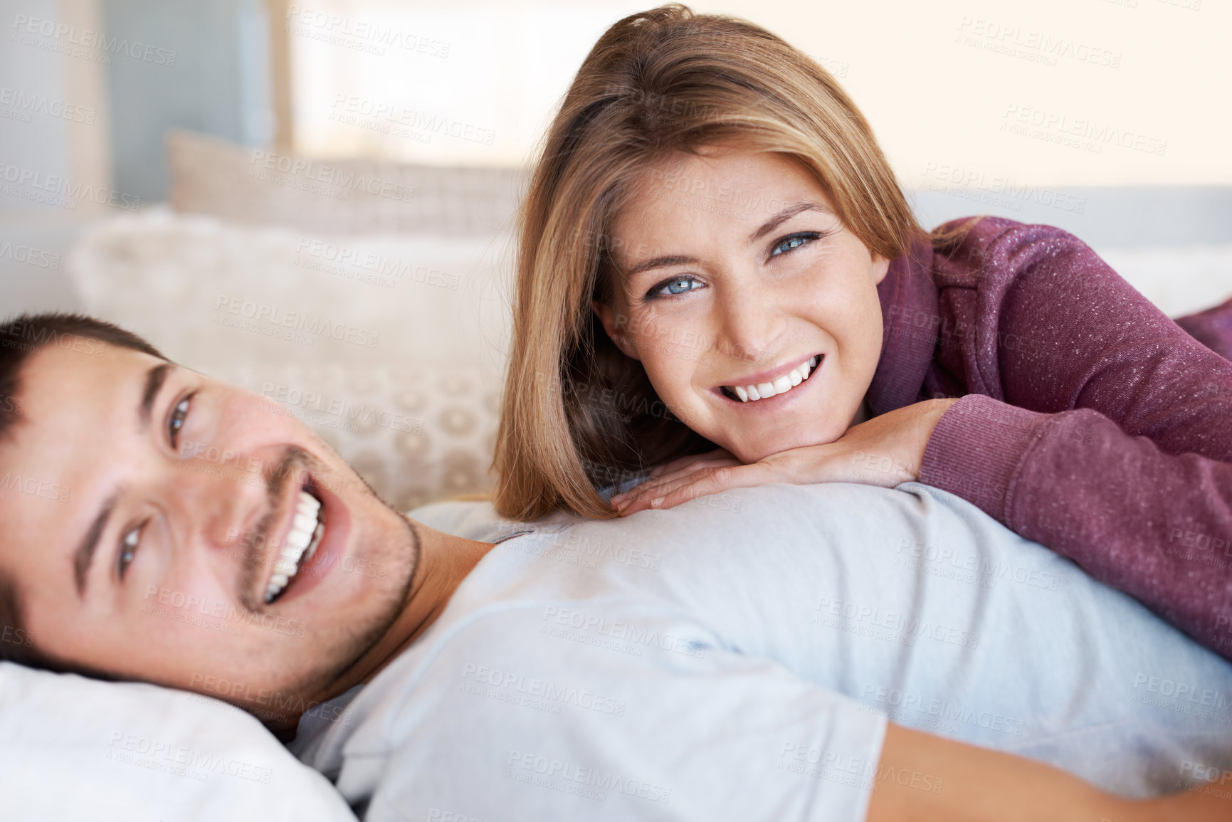 Buy stock photo Love, smile and portrait of couple on bed to relax, bonding and spending quality time together in home. Relationship, happy man and woman in bedroom with romance, embrace and care in apartment in USA