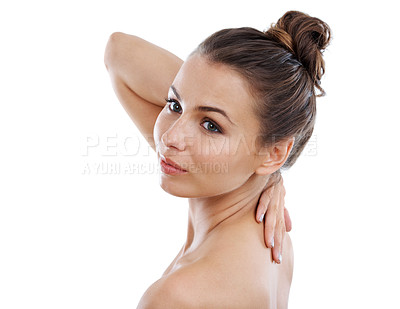 Buy stock photo Beautiful young woman with bare shoulders touching her back while isolated on a white background