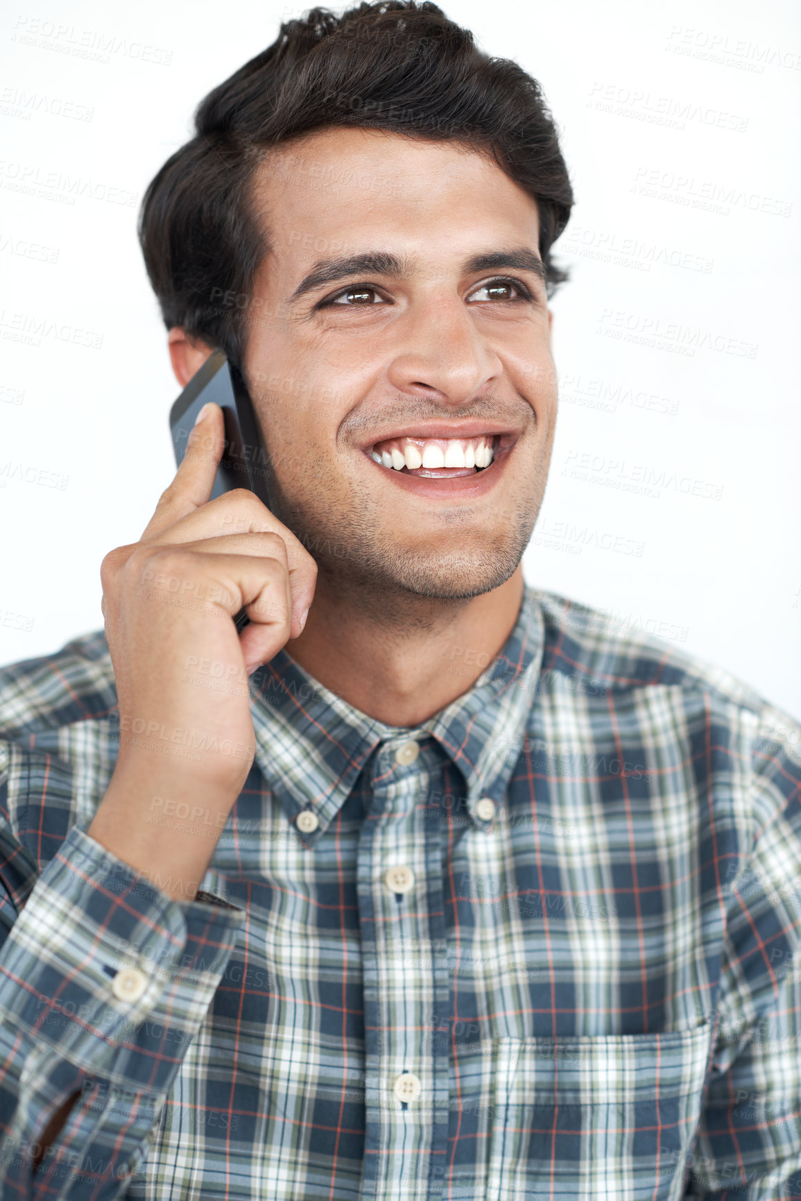 Buy stock photo Smile, phone call and creative man on white background in studio for communication, networking and chat. Designer, conversation and happy person speaking on smartphone for contact, discussion or talk