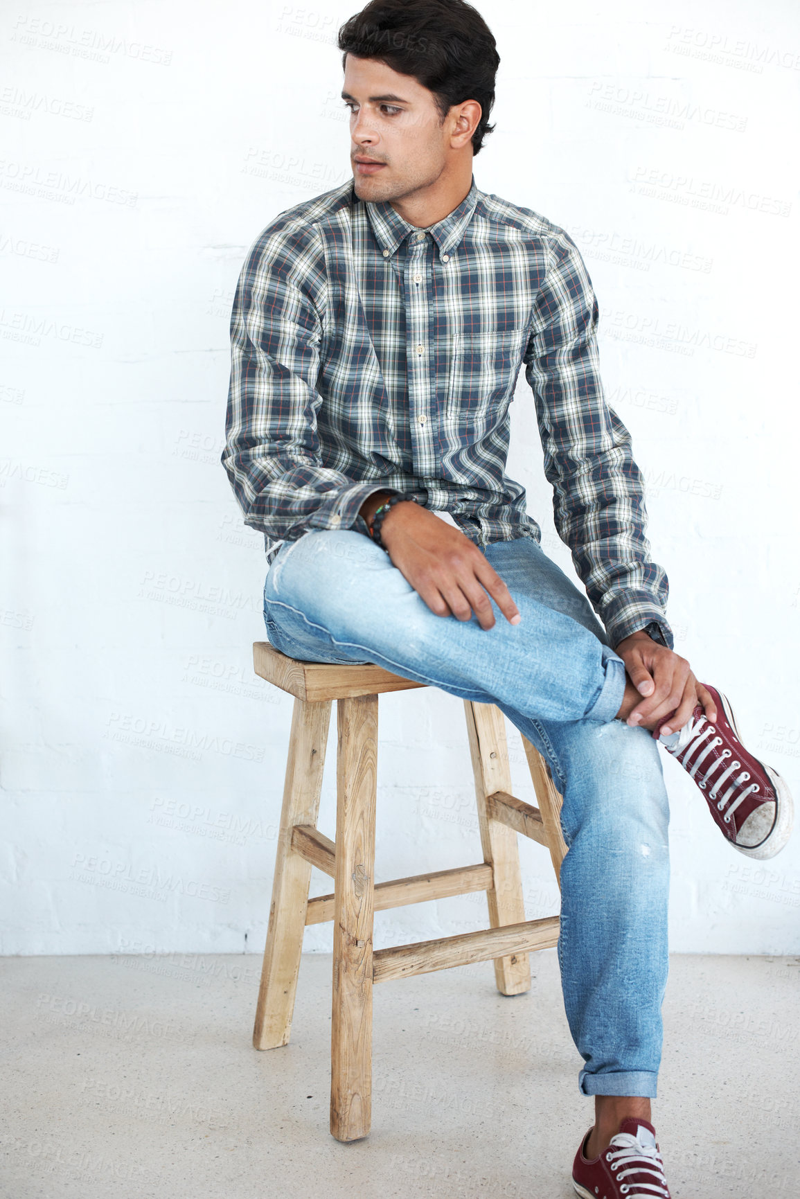 Buy stock photo Thinking, man and fashion in studio with on chair in casual wear, style and outfit on white background. Male person, isolated and portrait with swag and comfortable with shirt as stylist or designer 