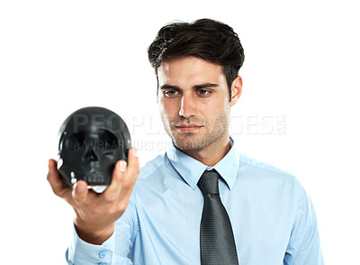 Buy stock photo Businessman, black skull in hand in studio for death, symbol and failure on white background. Mental health, man and skeleton head for hypnosis, emoji and bad luck, horror and end while isolated