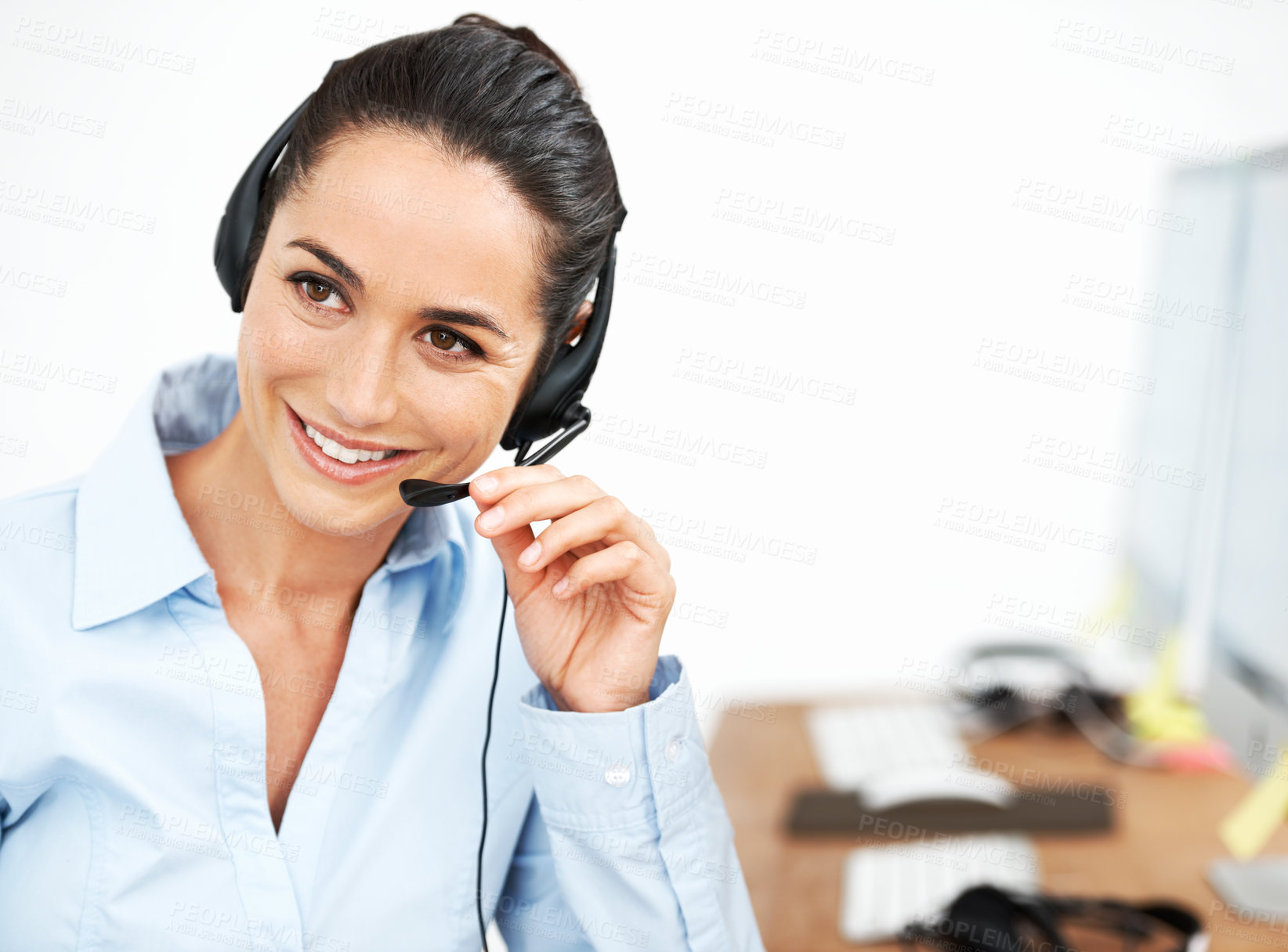 Buy stock photo Attractive female customer service agent using a headset for client services