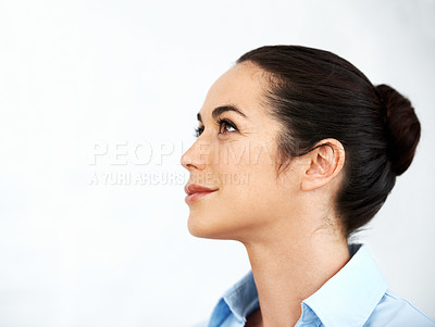 Buy stock photo Beautiful businesswoman looking away while thinking against a white background