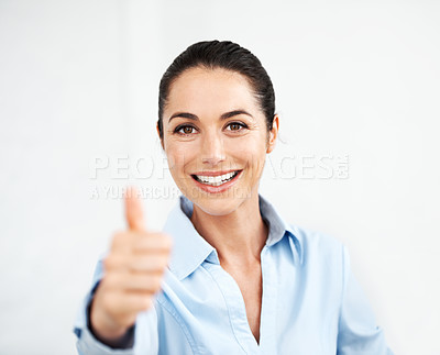 Buy stock photo Smiling businesswoman giving you a thumb's up against a white background
